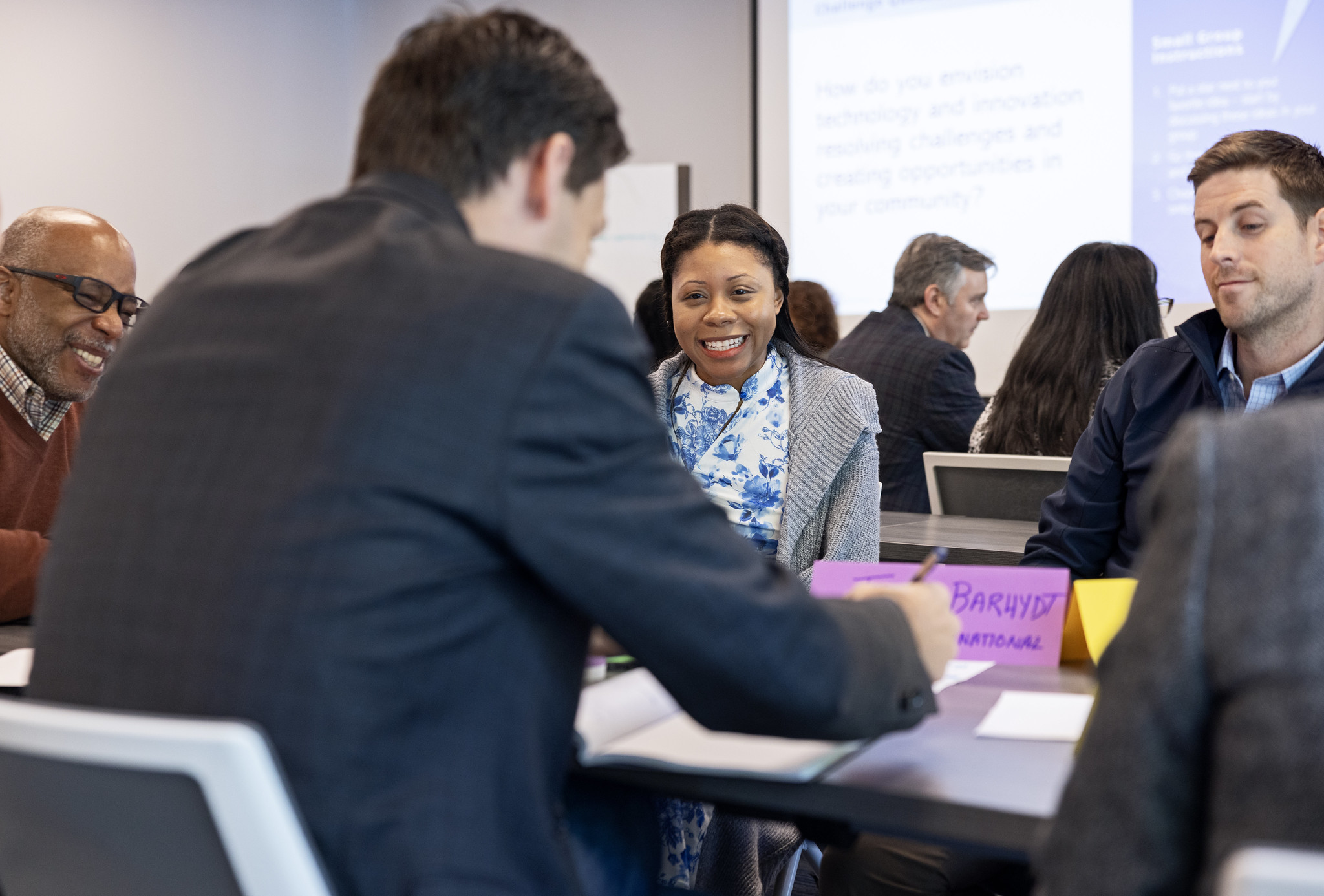 Hampton University’s International Students, Scholars and Programs Assistant Director Samaria Haysbert, center, smiles with her group mates during the Department of Energy (DOE) Boost Program meeting held in Newport News, Va., on Thursday, April 25, 2024.